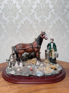 Soška zemědělce s koněm a psem Soška zemědělce s koněm a psem